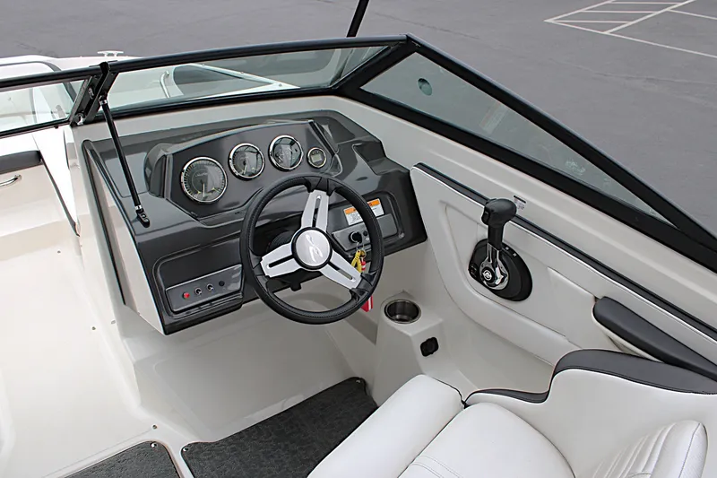Slide: The Image of 2017 Sea Ray SPX 190 Outboard boat cockpit with steering wheel and control panel. - 18