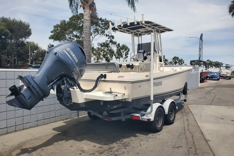 Slide: The Image of 2022 Defiance Commander 220 EX boat with Yamaha outboard motor on trailer. - 3