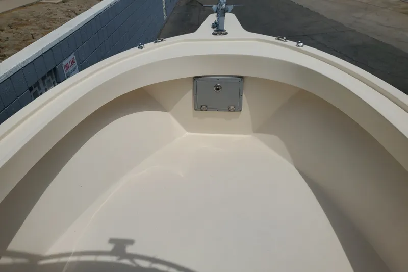 Slide: The Image of 2022 Defiance Commander 220 EX boat bow with storage compartment and cleat. - 10