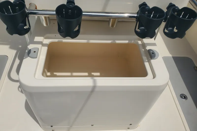 Slide: The Image of Fishing rod holders and storage compartment on 2022 Defiance Commander 220 EX boat. - 12