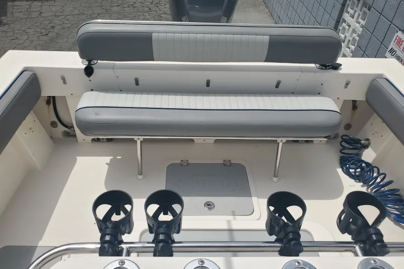 Slide: The Image of 2022 Defiance Commander 220 EX boat interior with seating and rod holders. - 15