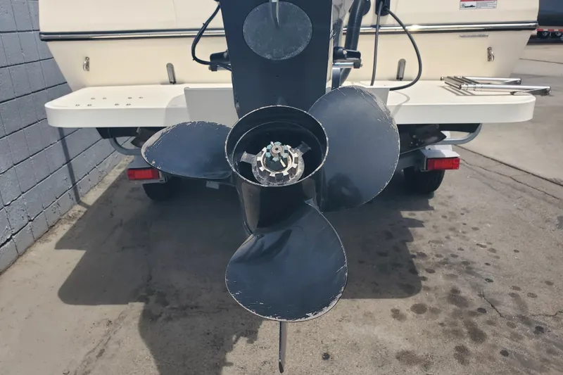 Slide: The Image of Propeller of 2022 Defiance Commander 220 EX boat on trailer, close-up view. - 21