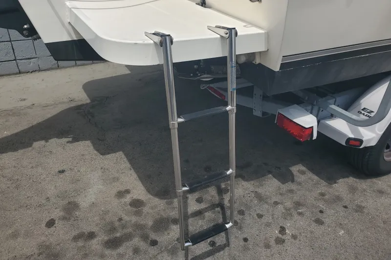Slide: The Image of 2022 Defiance Commander 220 EX boat ladder and trailer detail. - 25