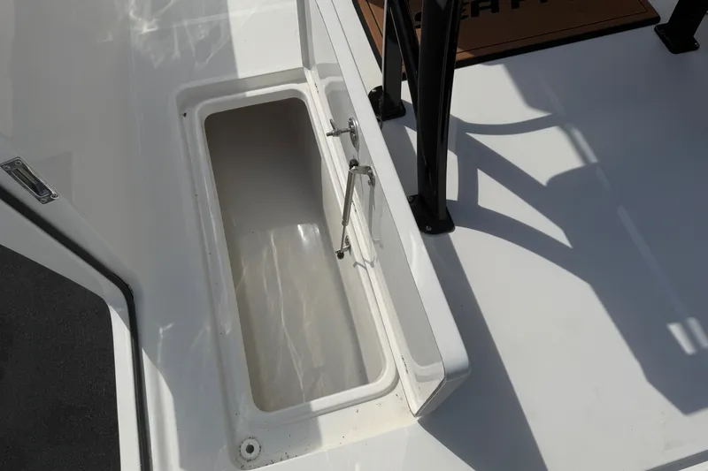 Slide: The Image of Open storage compartment on 2027 Sea Pro 262 DLX boat deck. - 37