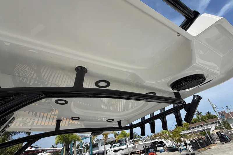 Slide: The Image of 2027 Sea Pro 262 DLX boat with sleek design and modern features, docked at marina. - 39