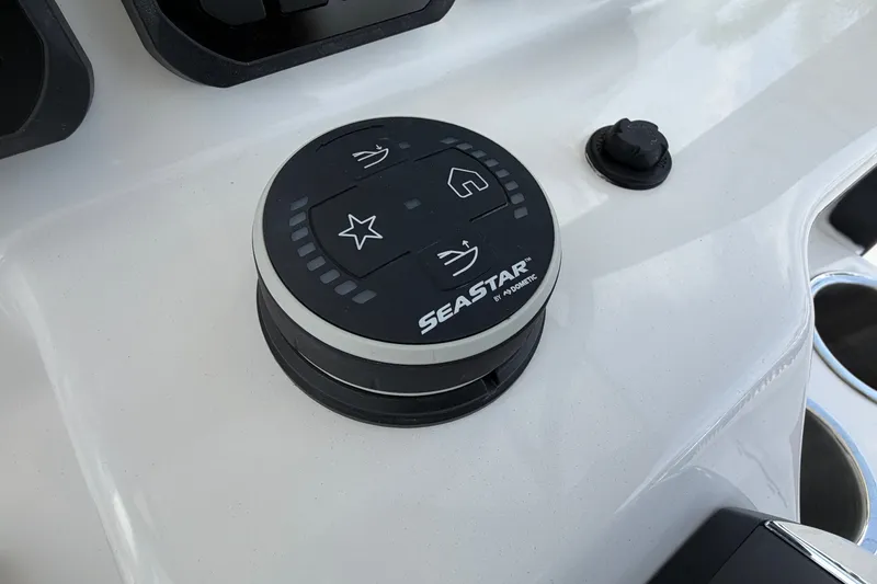 Slide: The Image of Control panel on 2027 Sea Pro 262 DLX boat featuring SeaStar by Dometic. - 33