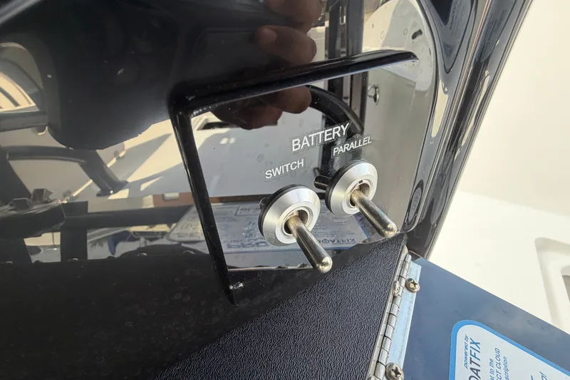 Slide: The Image of Battery switch and parallel toggles on 2027 Sea Pro 262 DLX boat. - 40