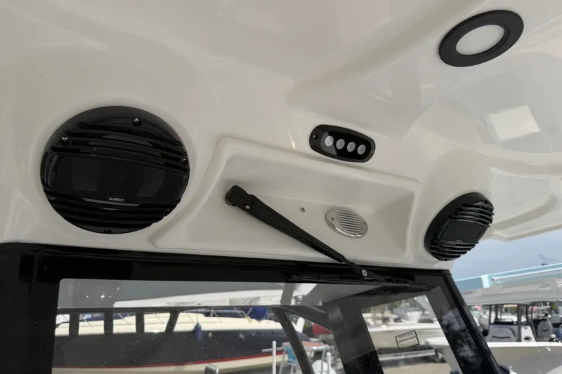 Slide: The Image of Interior view of 2027 Sea Pro 262 DLX boat featuring speakers and control panel. - 18