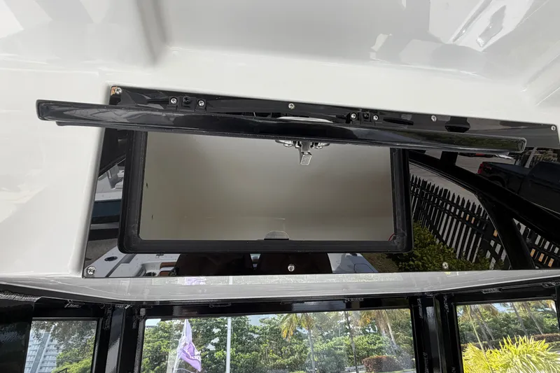 Slide: The Image of Open storage compartment on 2027 Sea Pro 262 DLX boat, showcasing sleek design. - 43