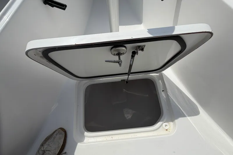 Slide: The Image of Open storage compartment on 2027 Sea Pro 262 DLX boat deck. - 44