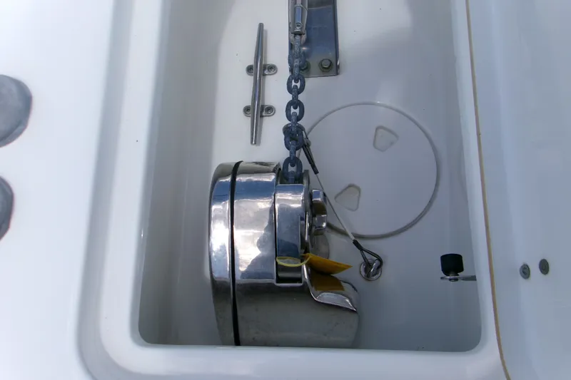 Slide: The Image of Anchor compartment of 2020 Sea Hunt Gamefish 25 boat with chain and cleat. - 18
