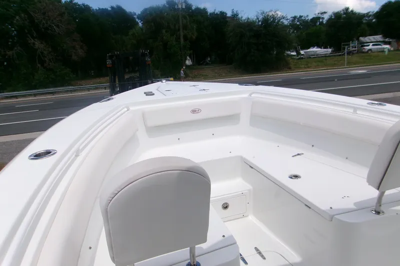 Slide: The Image of 2020 Sea Hunt Gamefish 25 boat interior, featuring spacious seating and sleek white design. - 13
