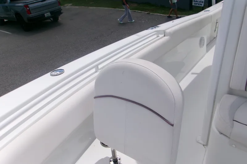 Slide: The Image of 2020 Sea Hunt Gamefish 25 boat interior with white seating and sleek design. - 14