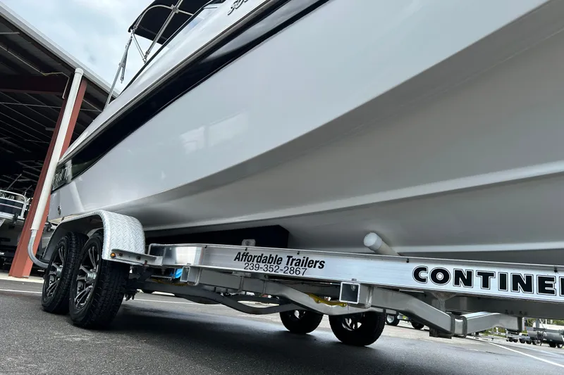 Slide: The Image of 2013 SouthWind 212 SD boat on a Continental trailer at a dealership. - 18