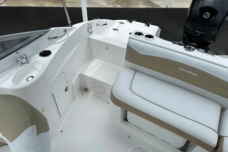 Slide: The Image of 2013 SouthWind 212 SD boat interior with seating and storage compartments. - 13