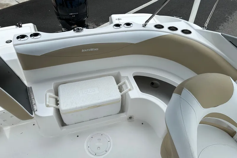 Slide: The Image of 2013 SouthWind 212 SD boat interior with seating and cooler storage. - 17