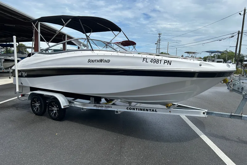 Slide: The Image of 2013 SouthWind 212 SD boat on trailer, parked outdoors. - 1