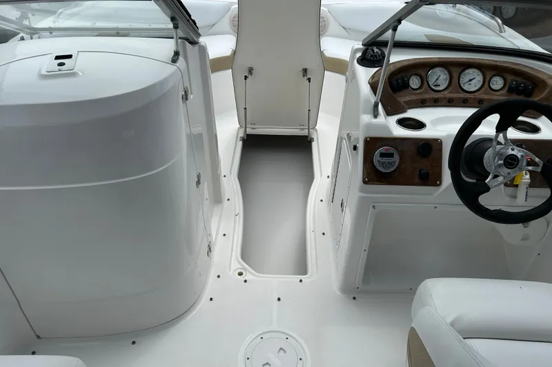 Slide: The Image of 2013 SouthWind 212 SD boat interior with steering wheel and dashboard controls. - 15