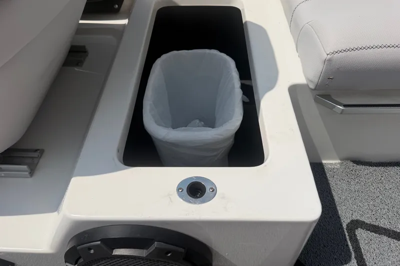 Slide: The Image of 2018 MasterCraft X46 boat interior with built-in trash compartment. - 15