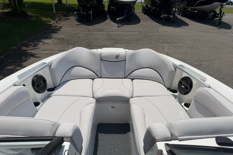 Slide: The Image of 2018 MasterCraft X46 boat interior with plush seating and built-in speakers. - 7
