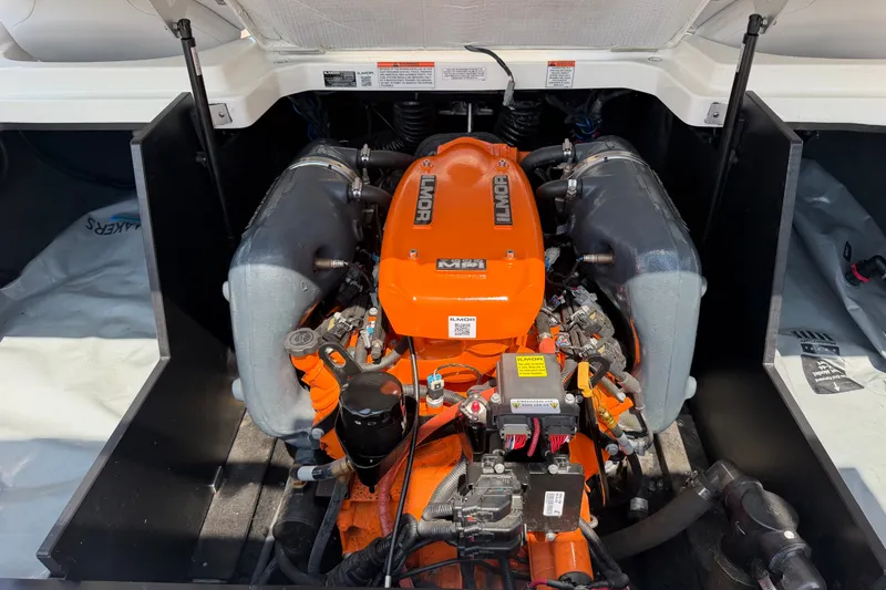 Slide: The Image of 2018 MasterCraft X46 boat engine, featuring an orange Ilmor motor. - 16