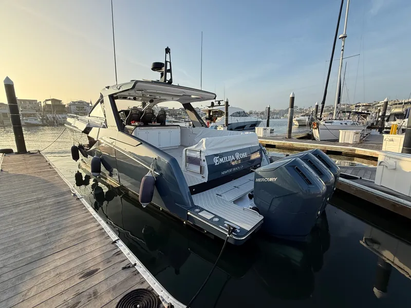 Slide: The Image of The 2025 Azimut Verve 48 is docked. It features a sleek design and powerful engines. - 1