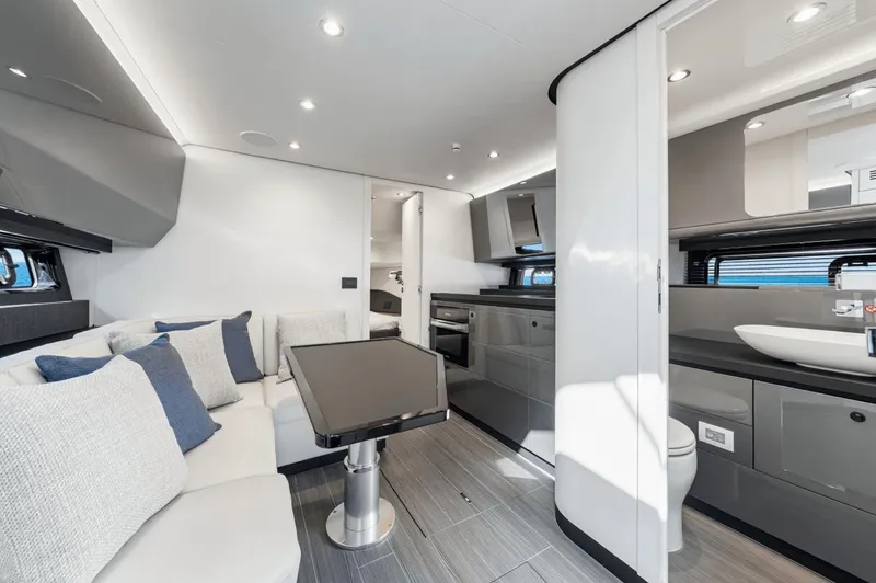 Slide: The Image of Interior of a modern yacht with sleek kitchen, cozy seating area, and stylish bathroom. - 6