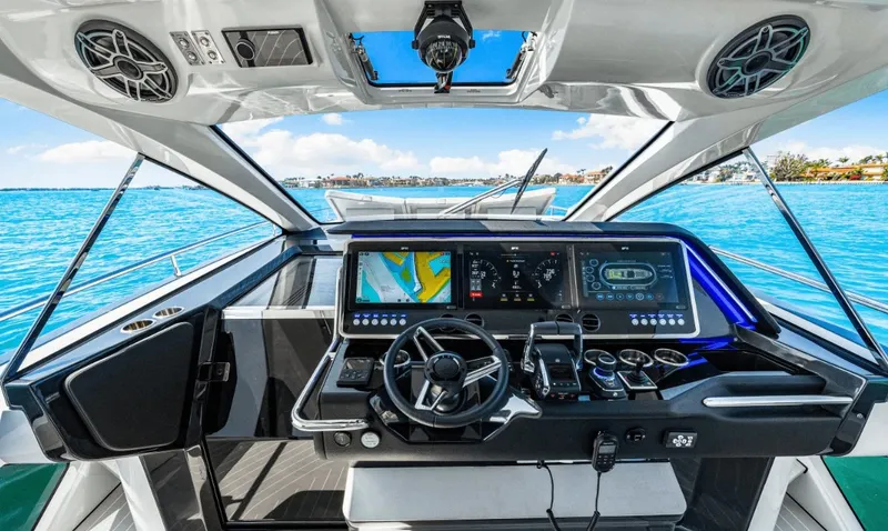 Slide: The Image of The 2025 Azimut Verve 48 cockpit features a modern helm with multiple screens. - 5
