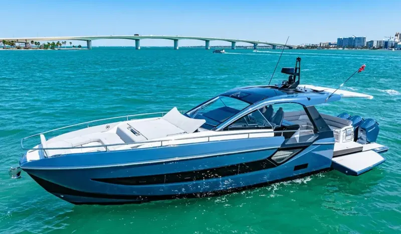 Slide: The Image of The 2025 Azimut Verve 48 glides on turquoise waters, featuring a sleek, modern design and luxurious details. - 3