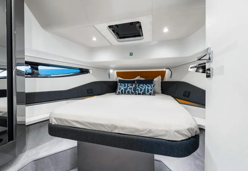 Slide: The Image of The 2025 Azimut Verve 48 cabin features a modern, sleek design with a large bed. - 8