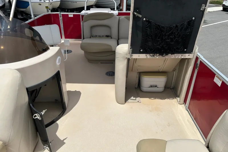 Slide: The Image of 2013 Sylvan Mirage Fish 8520 CNF boat interior with seating and storage compartments. - 16