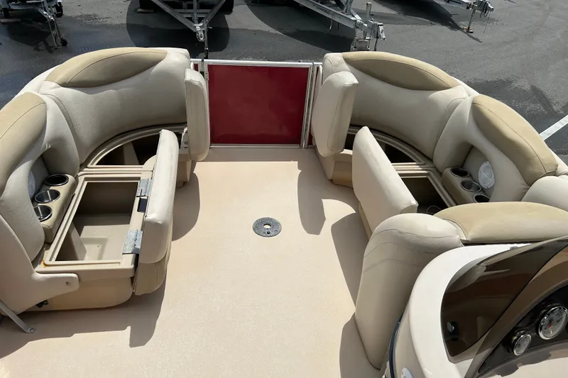 Slide: The Image of 2013 Sylvan Mirage Fish 8520 CNF interior with beige seating and storage compartments. - 15