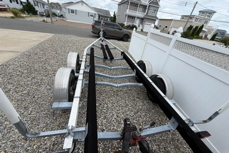 Slide: The Image of Boat trailer parked on gravel driveway, suitable for 2019 Sea Hunt Gamefish 25. - 37