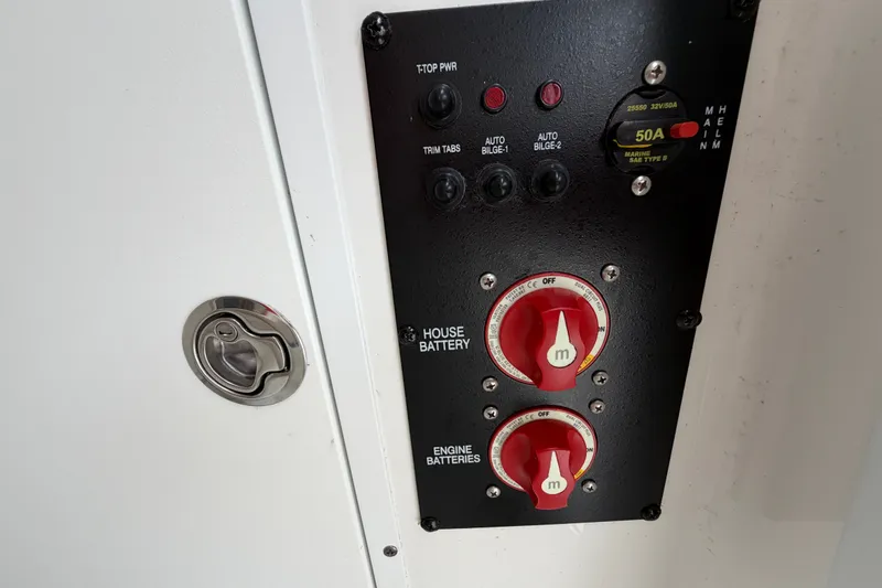 Slide: The Image of Control panel of a 2019 Sea Hunt Gamefish 25 boat with battery switches. - 32