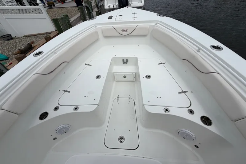 Slide: The Image of 2019 Sea Hunt Gamefish 25 boat interior with spacious seating and storage compartments. - 23