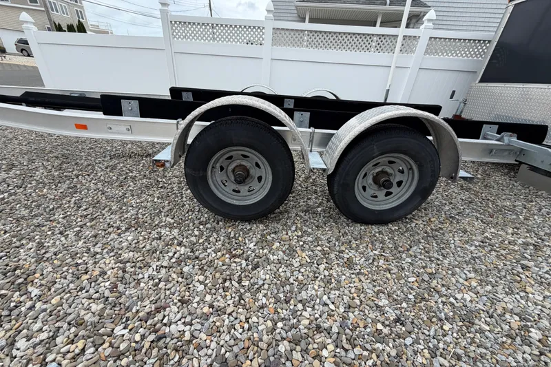 Slide: The Image of Trailer for 2019 Sea Hunt Gamefish 25 on gravel surface. - 36
