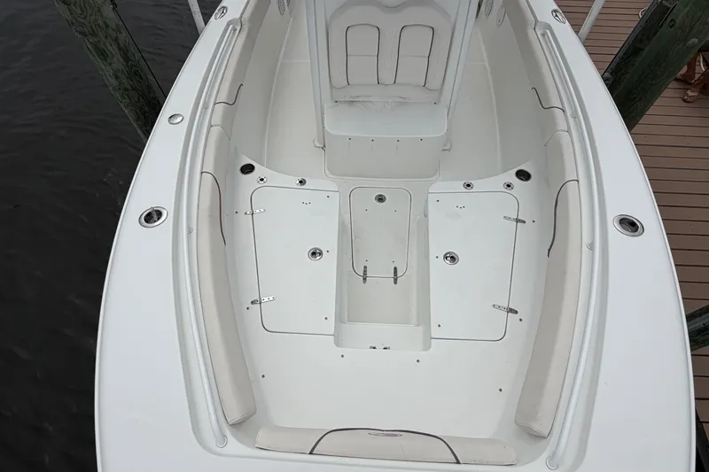 Slide: The Image of 2019 Sea Hunt Gamefish 25 boat interior with spacious seating and storage compartments. - 27