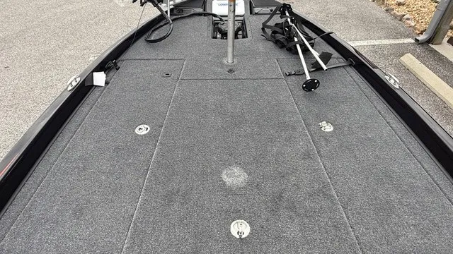Slide: The Image of The image shows the deck of a 2027 Phoenix 721 ZXL boat with gray carpeting. - 17