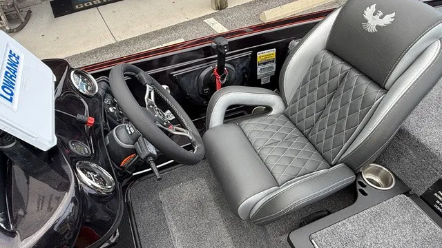 Slide: The Image of The image shows the interior of a 2027 Phoenix 721 ZXL boat with a sleek, upholstered seat. - 14