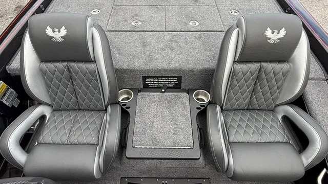 Slide: The Image of Two luxurious, padded seats with quilted pattern and Phoenix logo, surrounded by gray carpeting. - 15