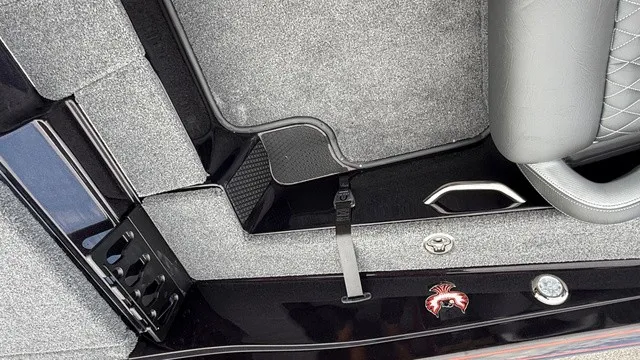 Slide: The Image of Close-up of a Phoenix 721 ZXL boat interior with gray carpeting and black accents. - 19