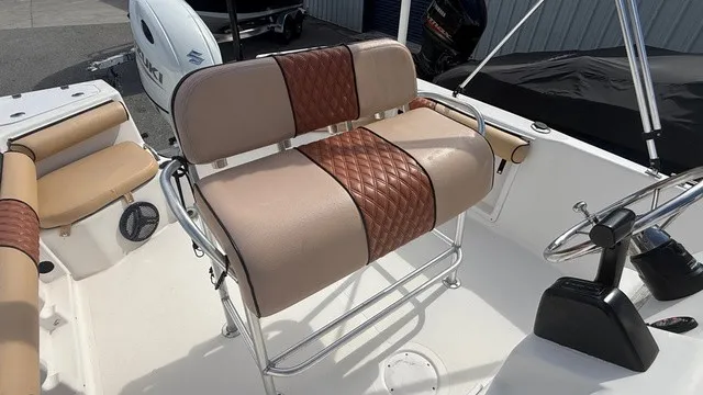 Slide: The Image of The 2007 Pro-Line Sport Series 20 features a cushioned bench seat with brown accents and a helm station. - 13