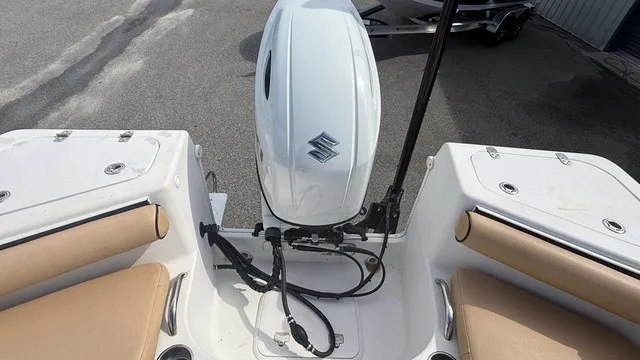 Slide: The Image of The image shows the stern of a 2007 Pro-Line SPORT SERIES 20 boat with a Suzuki outboard motor. - 16