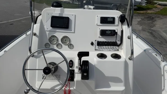 Slide: The Image of The image shows the helm of a 2007 Pro-Line Sport Series 20 boat with instruments and controls. - 9