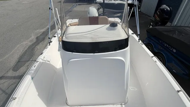 Slide: The Image of A 2007 Pro-Line Sport Series 20 boat with an open deck and helm console. - 11