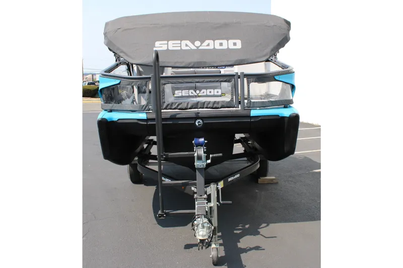 Slide: The Image of 2023 Sea-Doo Switch Sport Compact on trailer, covered, in parking lot. - 12