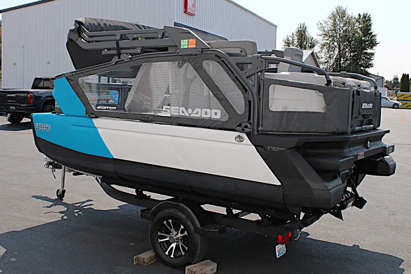 Slide: The Image of 2023 Sea-Doo Switch Sport Compact on trailer, featuring sleek design and vibrant blue accents. - 16