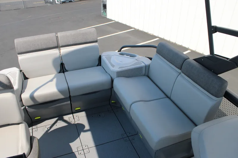 Slide: The Image of 2023 Sea-Doo Switch Sport Compact interior seating with gray upholstery and cup holders. - 23