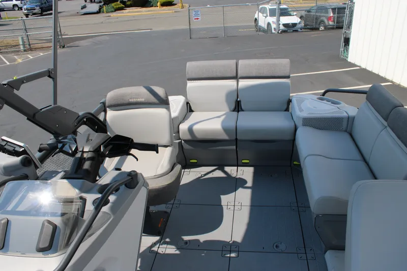 Slide: The Image of 2023 Sea-Doo Switch Sport Compact interior with gray seating and steering console. - 26