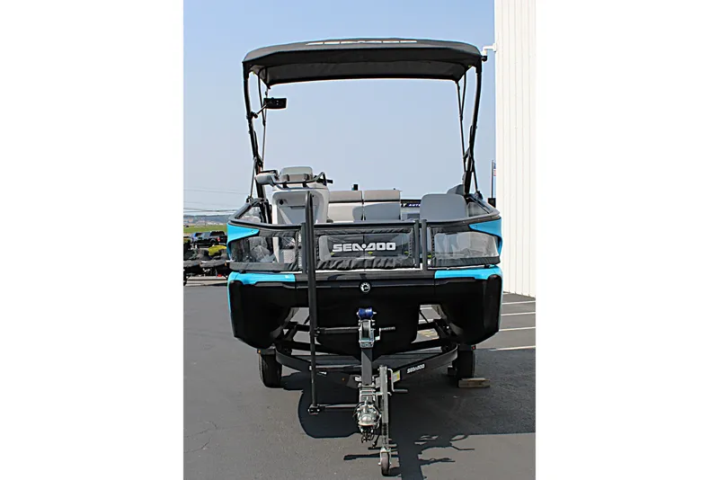 Slide: The Image of 2023 Sea-Doo Switch Sport Compact pontoon boat on trailer, front view. - 11